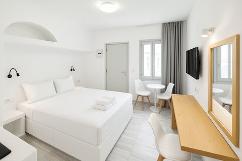Double bed, bistro table by the window, long wooden desk and full-length mirror
